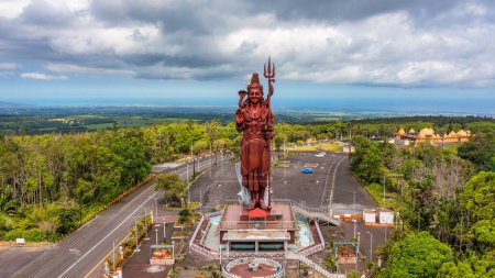 Shiva statue at Grand Bassin temple, the world's tallest Shiva temple, it is 33 meters tall. Important hindu temples of Mauritius. A large statue of the Hindu god Shiva, seen from above, Mauritius.