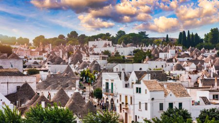 The traditional Trulli houses in Alberobello city, Apulia, Italy. Cityscape over the traditional roofs of the Trulli, original and old houses of this region, Apulia, Alberobello, Puglia, Italy. 