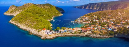 Photo for Assos village in Kefalonia, Greece. Turquoise colored bay in Mediterranean sea with beautiful colorful houses in Assos village in Kefalonia, Greece, Ionian island, Cephalonia, Assos village. - Royalty Free Image
