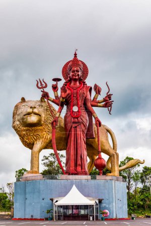 A powerful Statue of the Hindu goddess Durga Maa with a golden lion in sacred Ganga Talao. Shiva statue at Grand Bassin temple, the world's tallest Shiva temple, it is 33 meters tall. Mauritius