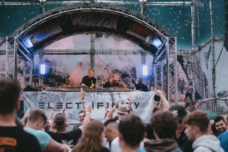 Photo for The electronic music festival "Electrifinity" in Bad Aibling,Germany with a DJ and dancing crowd - Royalty Free Image