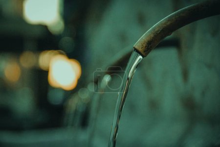 Photo for A closeup shot of pouring water from a pipe - Royalty Free Image