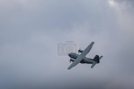 Photo for A low angle of RS-50 airplane flying at Bucharest International Air Show (BIAS 2022) - Royalty Free Image