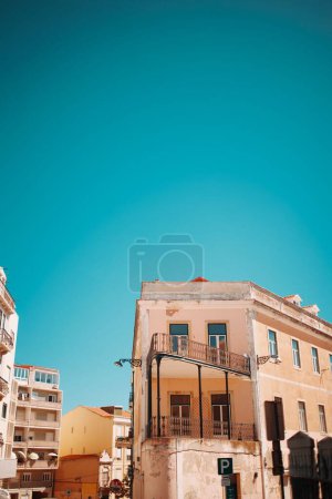 Photo for A low-angle vertical of a building clear sunlit sky background - Royalty Free Image