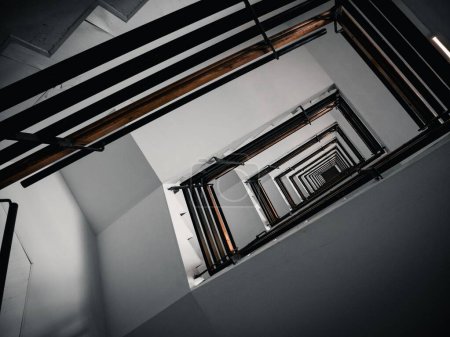 Photo for A low angle shot of a swirling stair case at Clinic Center of Naples in Italy - Royalty Free Image