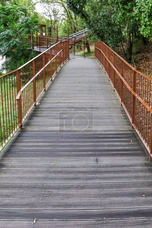 Photo for A vertical shot of a bridge trail with railings through the greenery to Leiria Castle in Leiria Portugal - Royalty Free Image