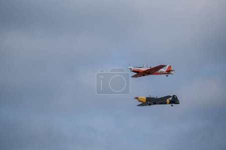 Photo for An aerial shot of two aircraft against the gloomy clouds at Bucharest International Air Show - Royalty Free Image