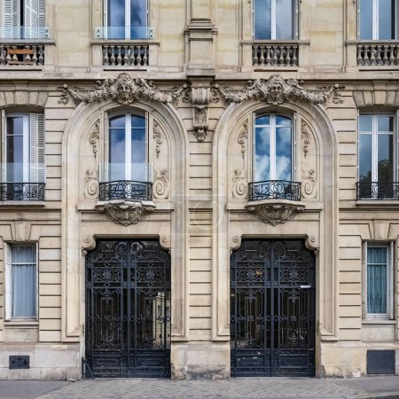 Photo for Paris, two ancient wooden doors, beautiful facade rue Saint-Dominique, in the 7e arrondissement - Royalty Free Image