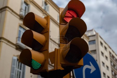 Photo for A low angle shot of traffic lights on the street against apartment buildings - Royalty Free Image