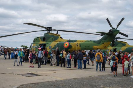 Photo for A green IAR 330 aircraft and a crowd at Bucharest International Air Show - Royalty Free Image