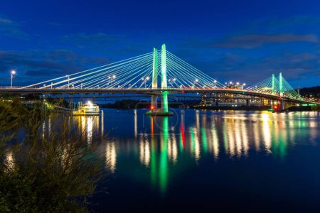 Photo for The lights of Tilikum Crossing Bridge reflecting on the water in the late evening - Royalty Free Image