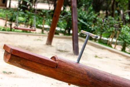 Photo for A closeup of a wooden seesaw part in an outdoor play garden - Royalty Free Image