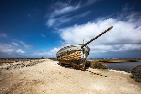 Photo for The old boat at the shore in the salt museum of Nubia, Trapani - Royalty Free Image