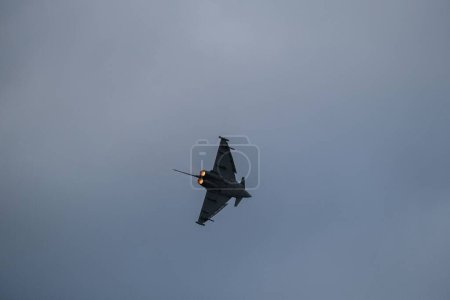 Photo for A low angle of 61-06 airplane flying at Bucharest International Air Show (BIAS 2022) - Royalty Free Image