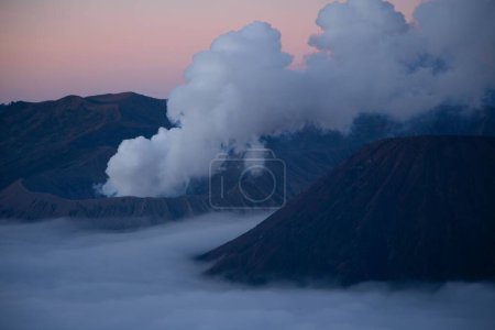Photo for Aerial view of the Mount Bromo at sunrise over blanket clouds, active volcano in East Java, Indonesia. - Royalty Free Image