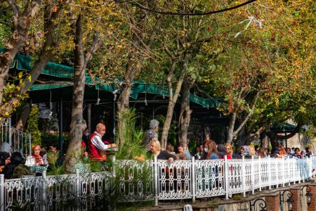 Photo for Many people sitting at Pierre Loti Cafe, enjoying and drinking tea in Istanbul, Turkey - Royalty Free Image