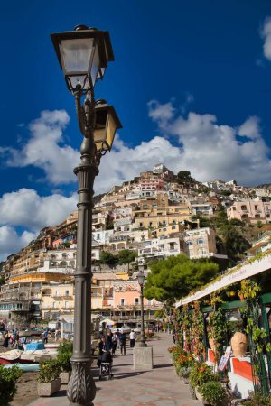 Photo for A vertical shot of street lamps and Positano Pyramid in the background. Amalfi Coast, Campania, Italy. - Royalty Free Image