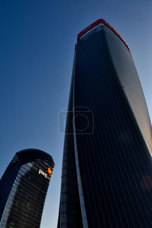 Photo for A low-angle vertical shot of skyscrapers in Milan against a blue sky - Royalty Free Image