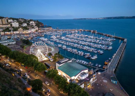 Photo for An aerial view of the Torquay Marina with moored boats and yachts in the evening - Royalty Free Image