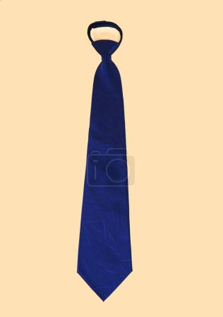 Photo for A vertical shot of a blue polyester necktie isolated on a yellow background. - Royalty Free Image
