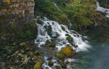 Photo for An autumn landscape with a long exposure waterfall in Rastoke village, Croatia - Royalty Free Image