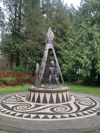 Photo for A sculpture in surrounded by growing trees in Stanley park - Royalty Free Image