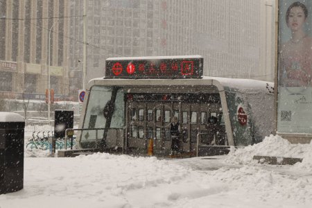 Photo for A public transportation stop under snowfall in the snowy streets of Shenyang, China - Royalty Free Image