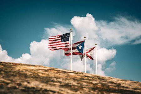 Photo for A closeup shot of Puerto Rico, Cross of Burgundy and American flags on the top of El Morro - Royalty Free Image