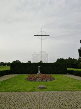 Photo for A vertical shot of a Lidice Memorial cross statue to the Children Victims of World War II in a park - Royalty Free Image