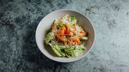 Photo for A top view of delicious Cesar salad on the table - Royalty Free Image