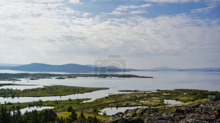 Photo for The aerial scenic view of coastal greenery under the partially cloudy sky in Iceland - Royalty Free Image