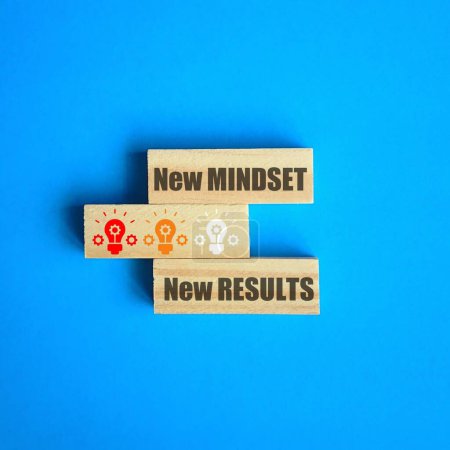 Photo for A new mindest, new results quote on wooden sticks with blue background. Energy concept - Royalty Free Image