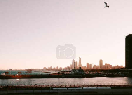 Photo for A beautiful shot of Brooklyn Bridge with skyscrapers in the background at sunset - Royalty Free Image