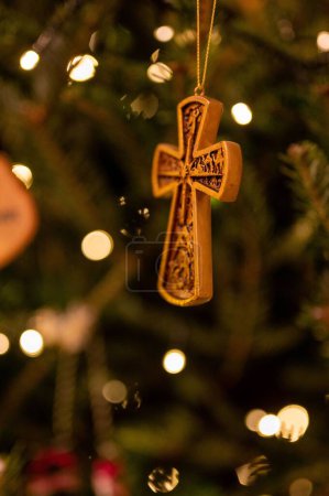 Photo for A vertical shot of a wooden cross with bokeh lights effects - Royalty Free Image