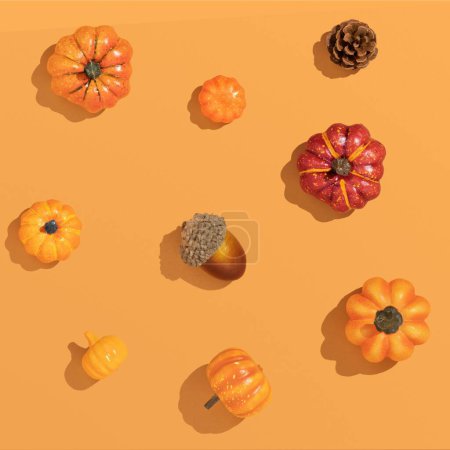 Photo for A 3D autumn composition of pumpkins and seasonal fruits on an orange background with sharp shadows -harvest concept - Royalty Free Image