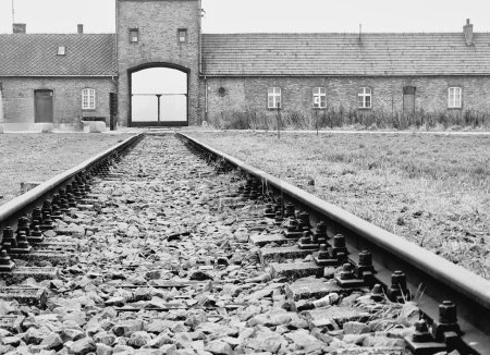Photo for A grayscale shot of the old empty railroad track in Auschwitz concentration camp - Royalty Free Image