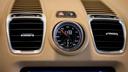 Photo for A closeup of Porsche Cayman S dashboard sport chrono clock - Royalty Free Image