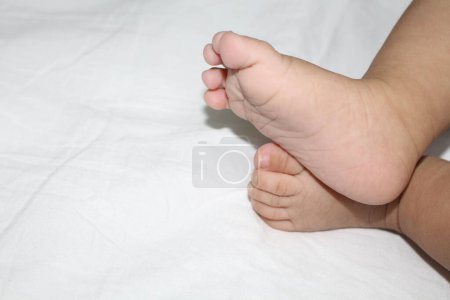 Photo for A closeup shot of feet of a two-month-old baby - Royalty Free Image