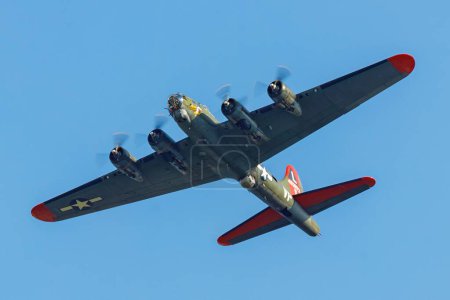 Photo for A low angle shot of B-17G flying fortress Texas Raiders in the blue sky - Royalty Free Image