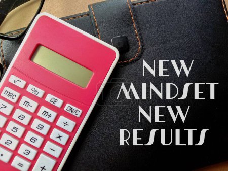 Photo for A new mindest, new results quote and calculator on a wallet - Royalty Free Image