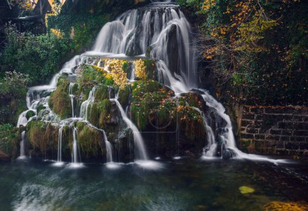 Photo for An autumn landscape with a long exposure waterfall in Rastoke village, Croatia - Royalty Free Image