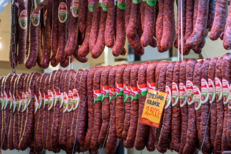 Photo for A closeup shot of Hungarian salami hanging in the Central Hall Market - Royalty Free Image