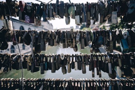 Photo for A closeup shot of a bunch of locks hanging on the bridge - Royalty Free Image