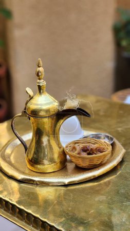 Photo for A golden arabic coffee pot with sweets - Royalty Free Image