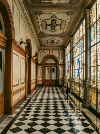 Photo for A vertical shot of a corridor with stained glass windows in the historical Chapultepec Castle - Royalty Free Image