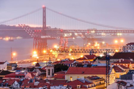 Photo for The Lisbon skyline with the 25 de Abril Bridge in the background. - Royalty Free Image