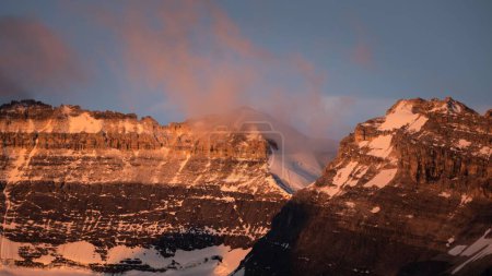 Photo for An aerial view of snow covered mountain landscape during sunset - Royalty Free Image
