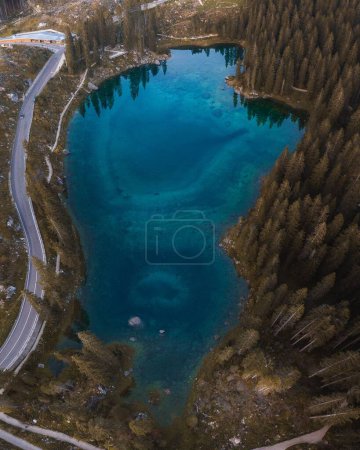 Photo for An aerial view of the Great Dolomites Road and lake in the countryside Bolzano in Italy - Royalty Free Image