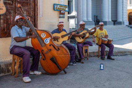 Photo for The street musicians performing outdoors - Royalty Free Image