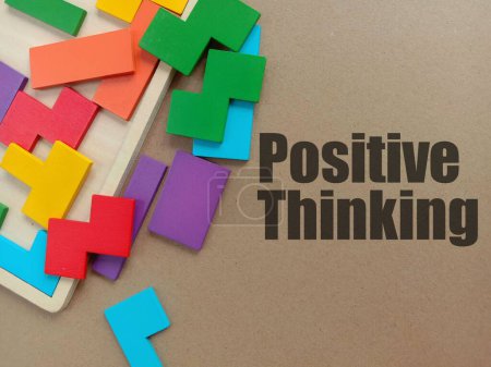 Photo for The colorful wooden puzzle pieces with POSITIVE THINKING text on beige background - Royalty Free Image